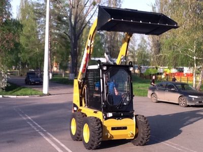 CAT 216 с ковшом